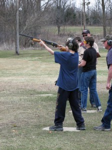 Young male shooting shotgun trap at COSC in Dimondale Michigan
